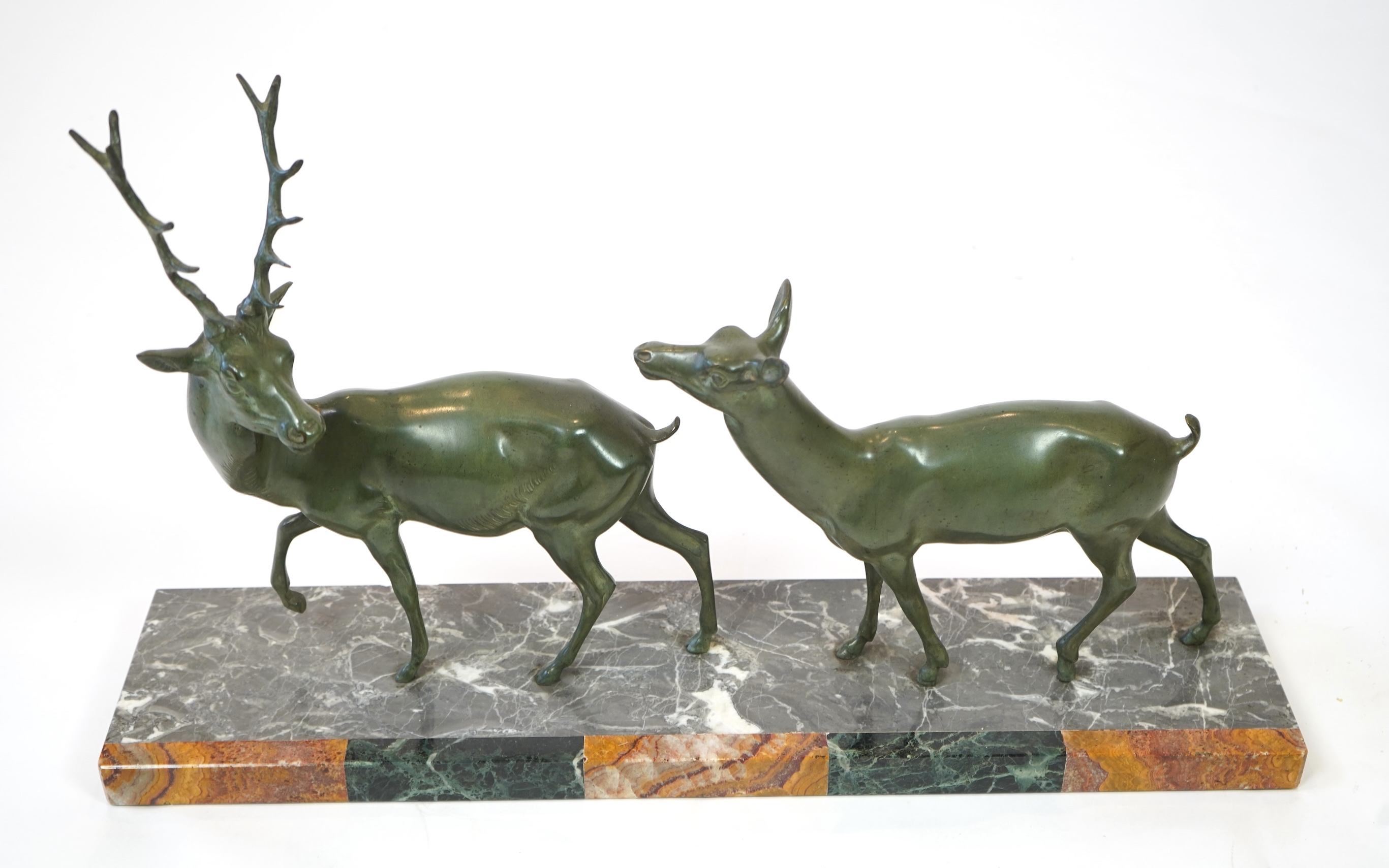Manner of Louis-Albert Carvin, French 1875-1951, An Art Deco bronze group of a stag and doe